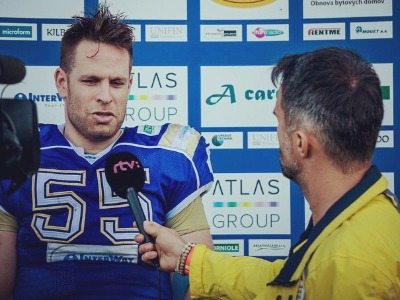 Viktor Rajek in an interview in his football uniform.
